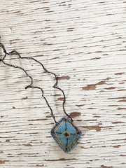 hand-stitched fabric amulet charm with adjustable clasp: blue