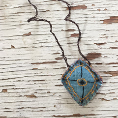 hand-stitched fabric amulet charm with adjustable clasp: blue