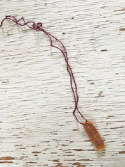 hand-stitched fabric amulet charm with adjustable clasp: ochre