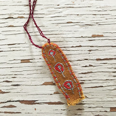 hand-stitched fabric amulet charm with adjustable clasp: ochre