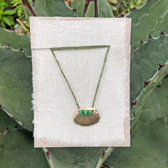 adjustable necklaces: yellow bronze charm with a trio of vintage beads on crocheted cord