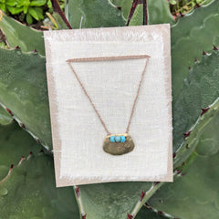 adjustable necklaces: yellow bronze charm with a trio of vintage beads on crocheted cord