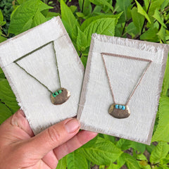 adjustable necklaces: yellow bronze charm with a trio of vintage beads on crocheted cord