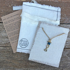 fan: yellow bronze charm wrapped with indigo-dyed thread on crocheted tussah silk