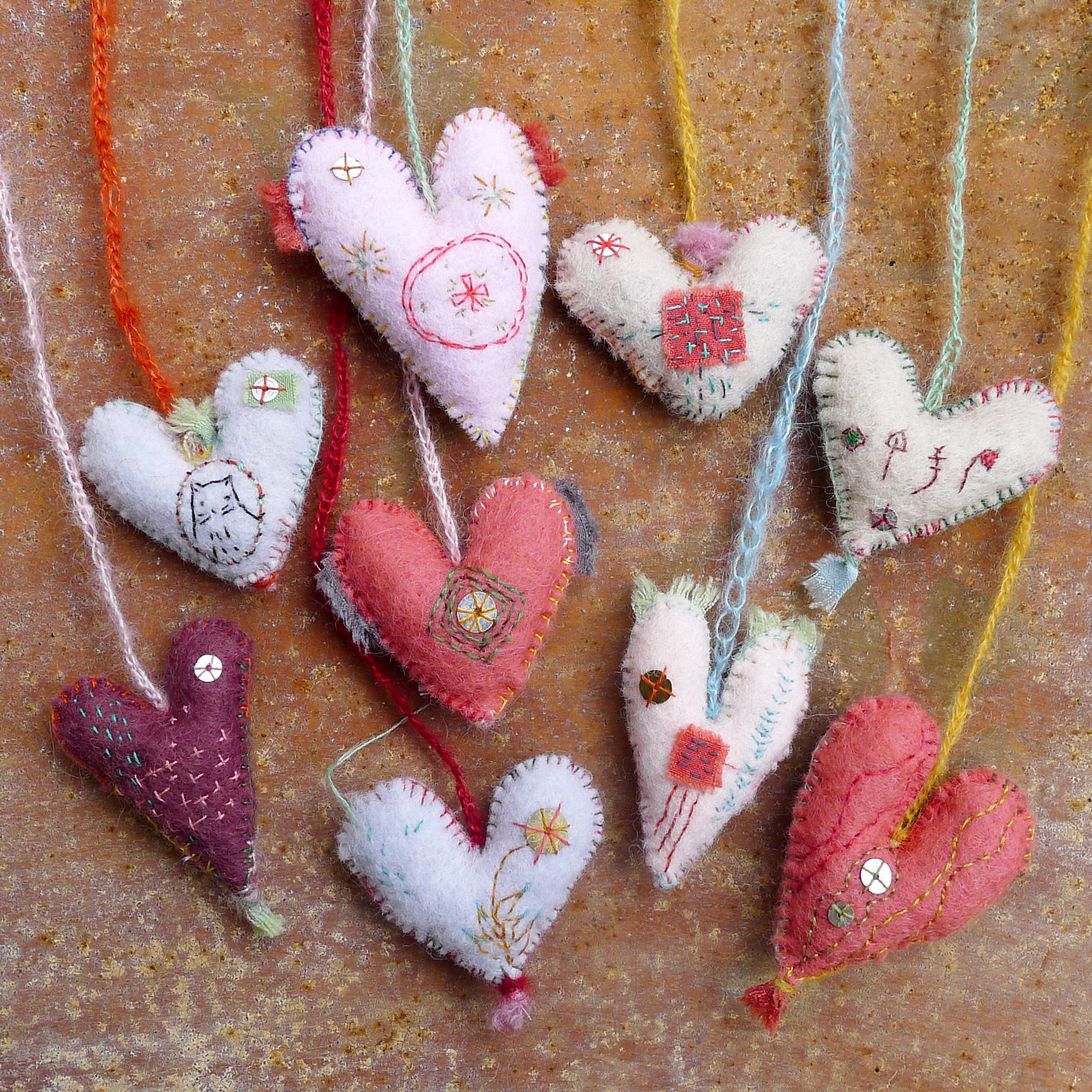 heavily stitched felt hearts – kata golda handmade