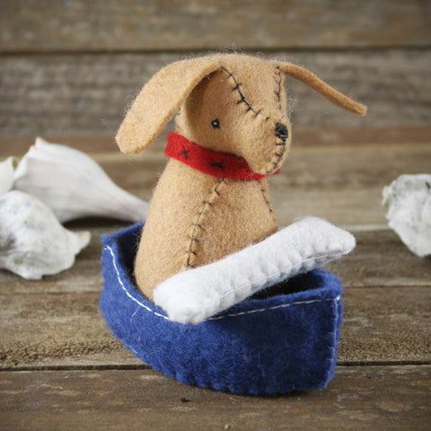 wool felt toy: dog and bone in boat