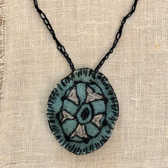 hand-stitched indigo amulet charm with adjustable clasp: pie