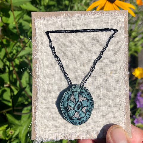 hand-stitched indigo amulet charm with adjustable clasp: pie
