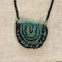 hand-stitched indigo amulet charm with adjustable clasp: smile