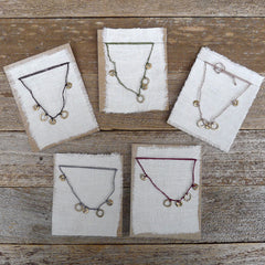 five charm necklace: loop and ring