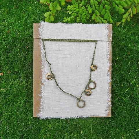 five charm necklace: loop and ring