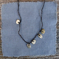 five charm necklace: pebble and pond