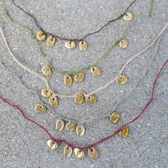 five charm necklace: pebble and pond