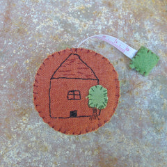 tape measure: terracotta/house